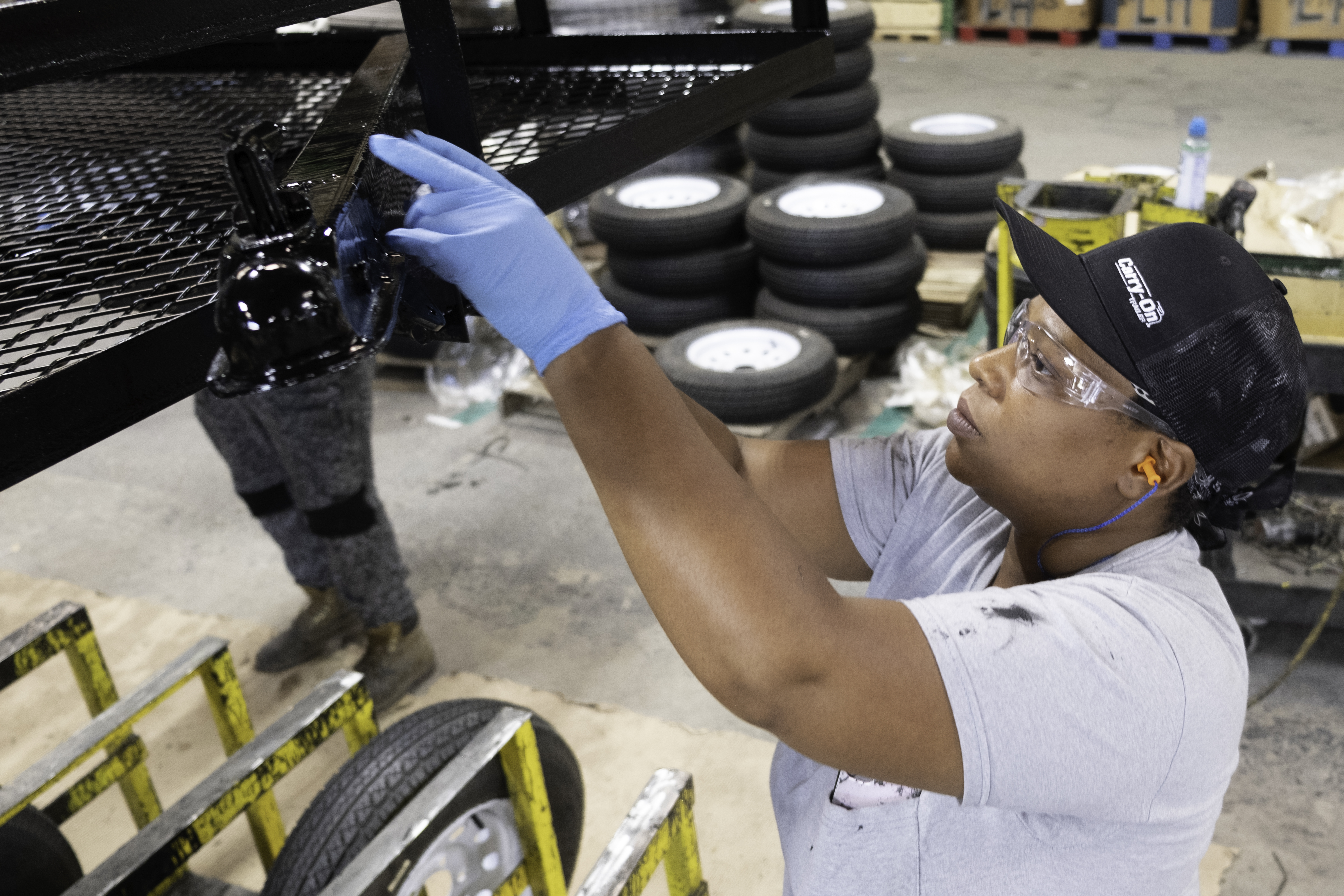A woman working on a piece of machinery