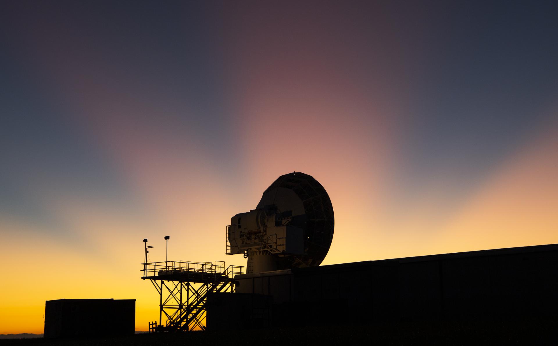 A communications antenna at sunrise