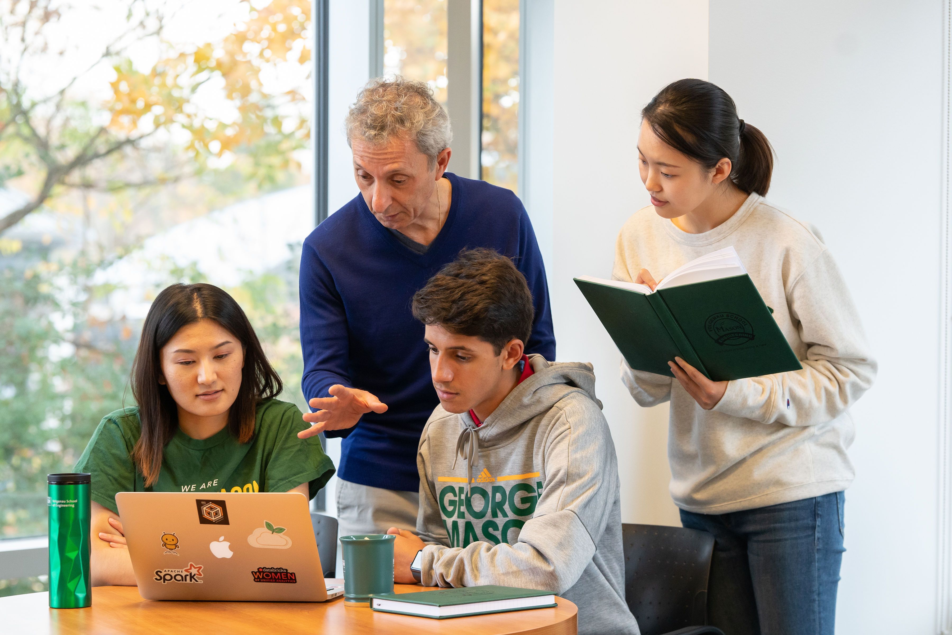 Prof. James Baldo works with graduate students