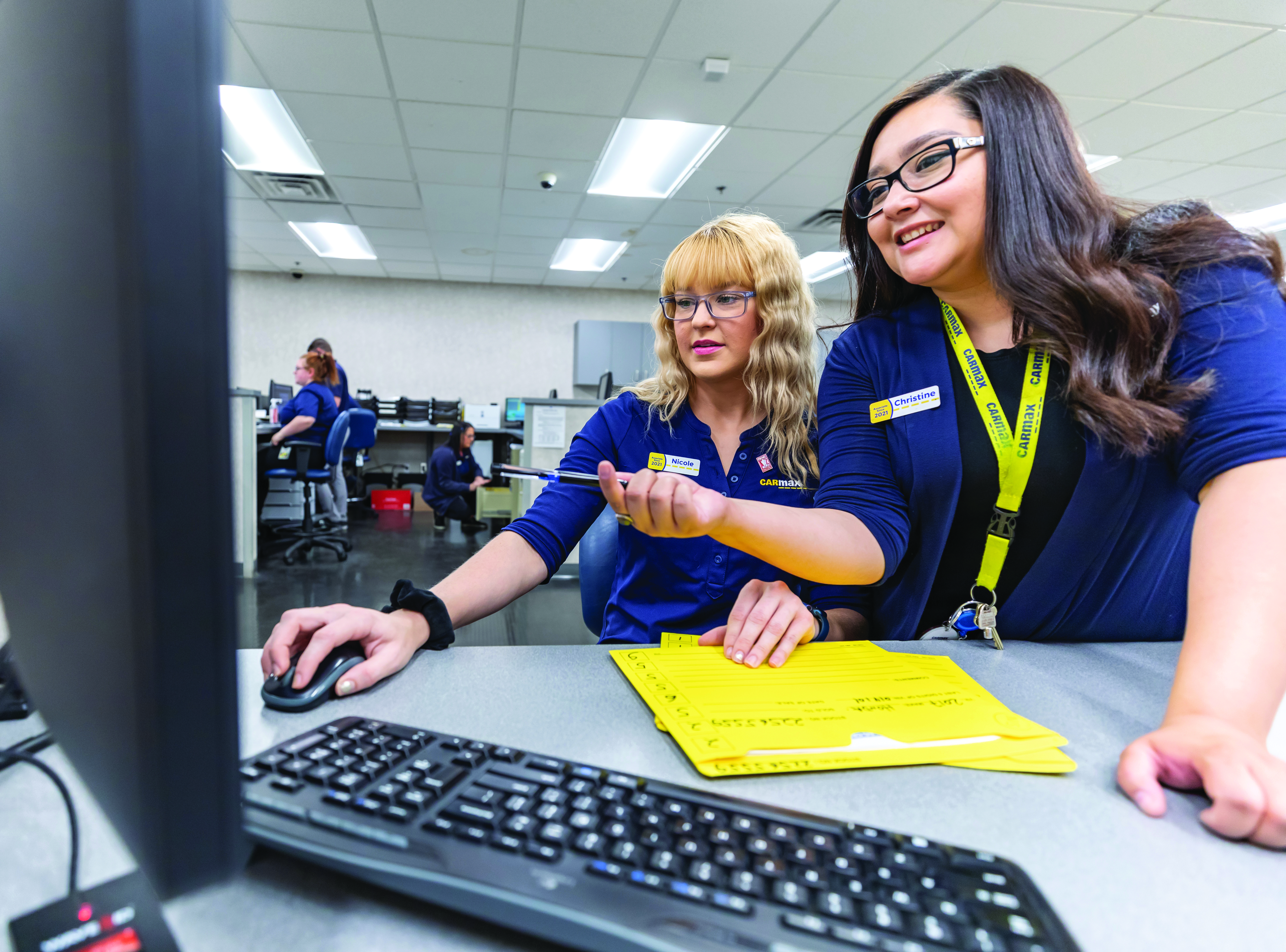 Two female CarMax employees