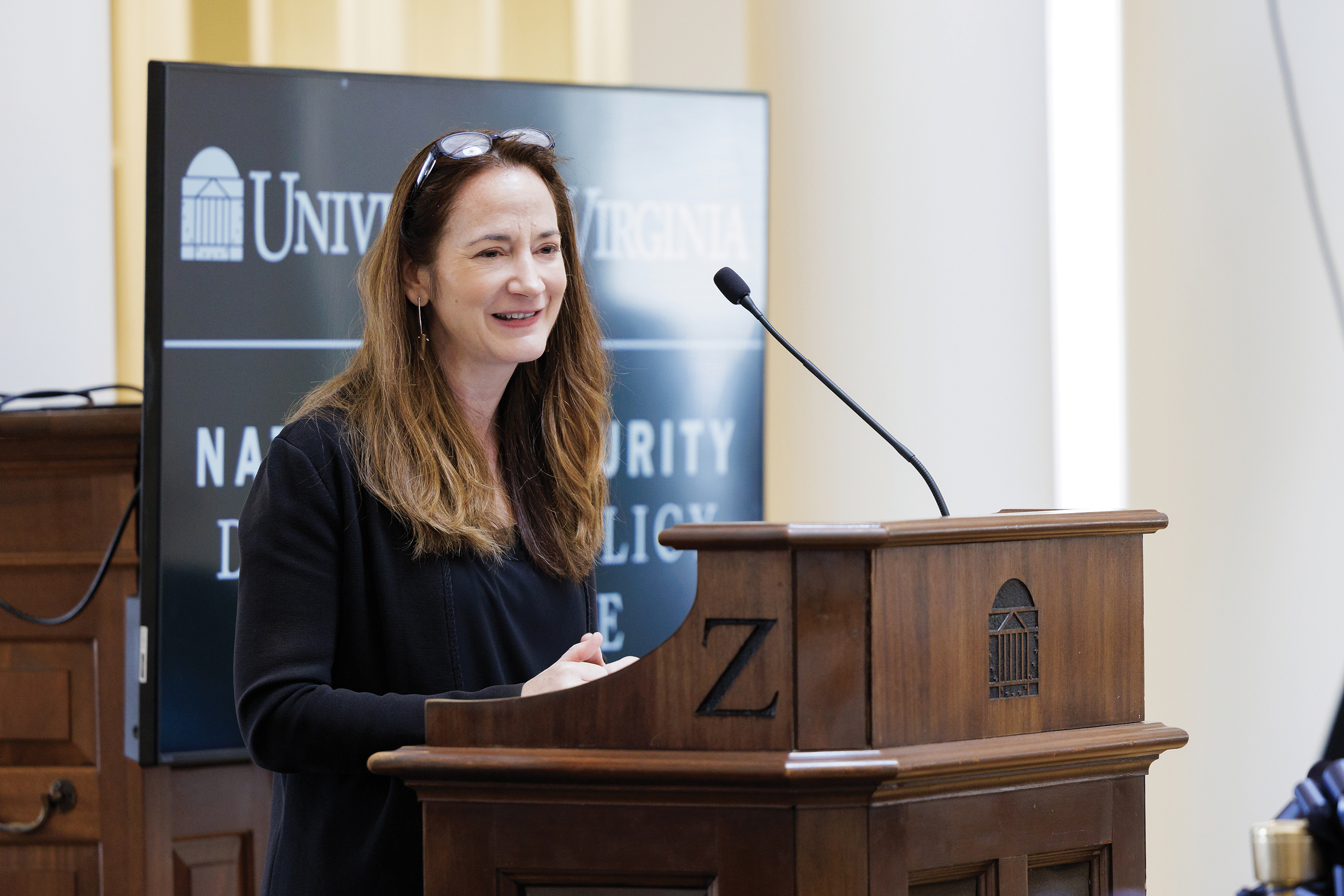 Avirl Haines speaking at a podium