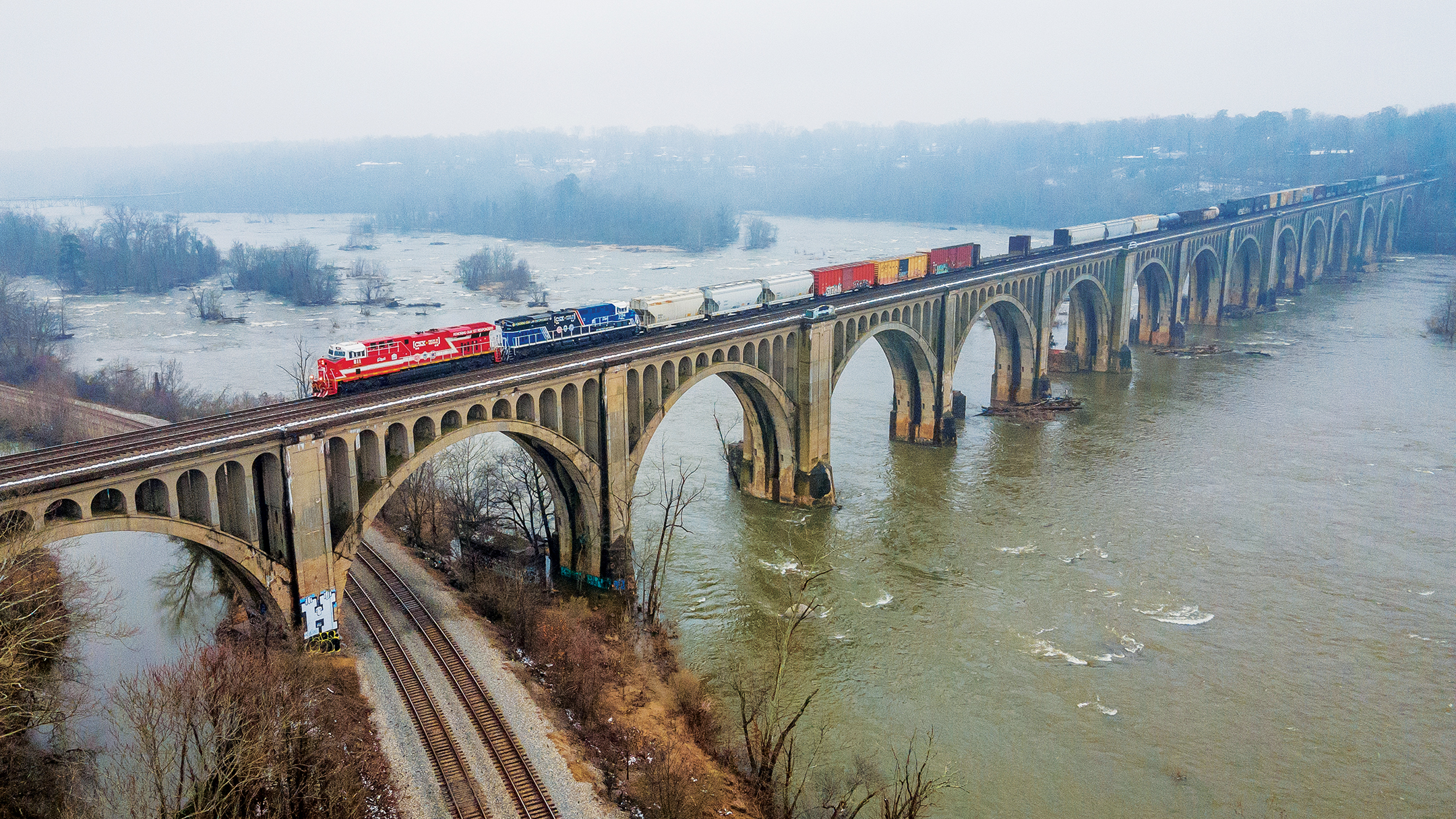 CSX Locomotive train going over a bride on the James River in Richmond