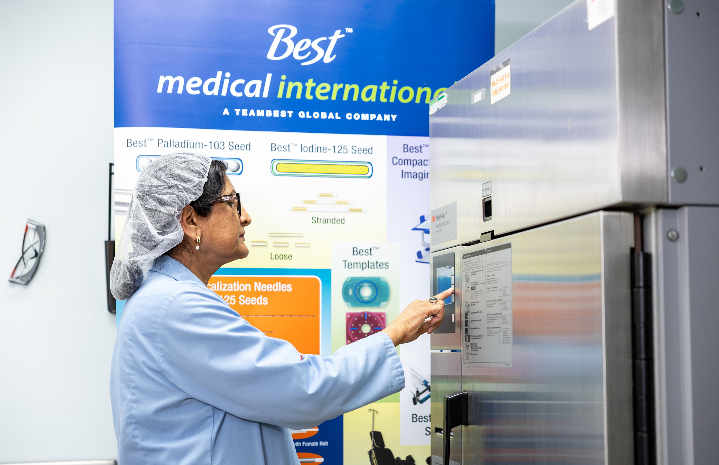 Employee using machinery. 