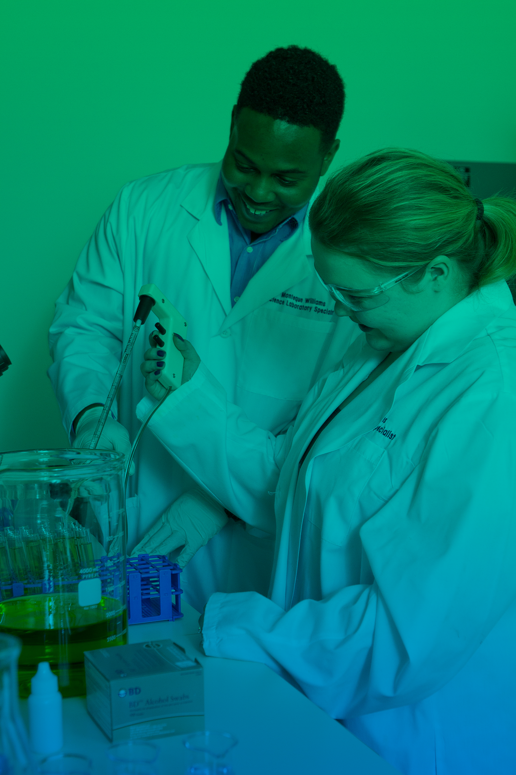 Two students conducting a lab experiment. 