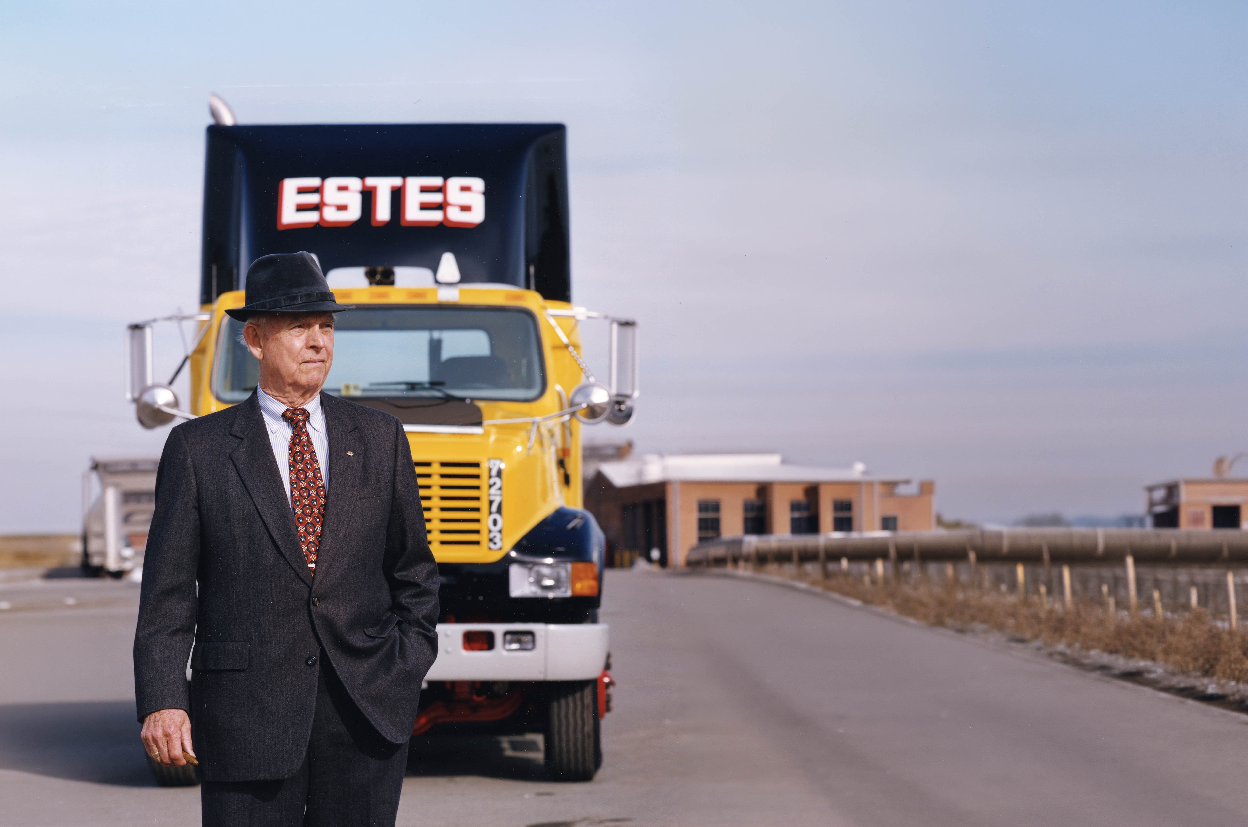 Robey Estes in front of Estes truck
