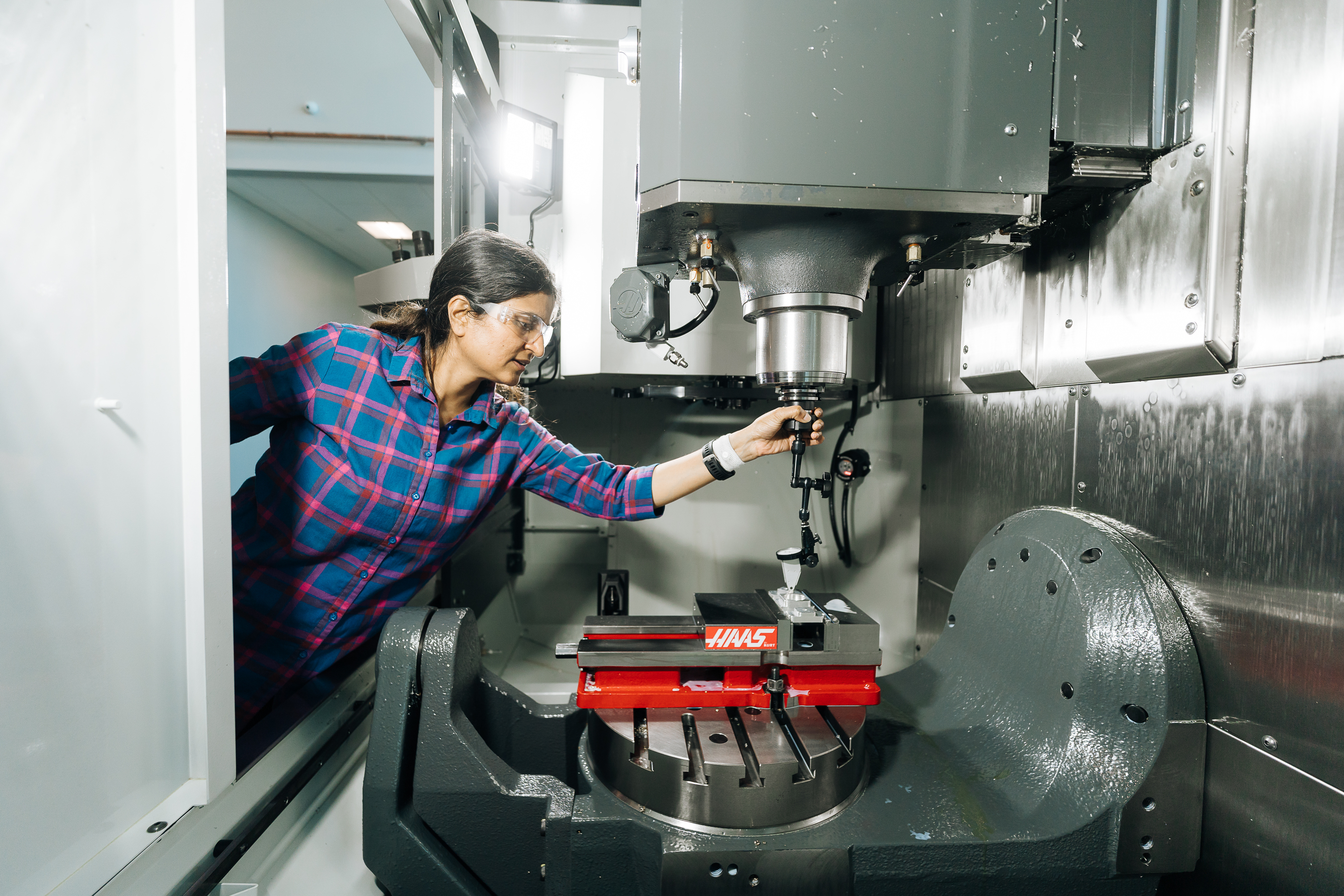 Photo of a woman working on a machine