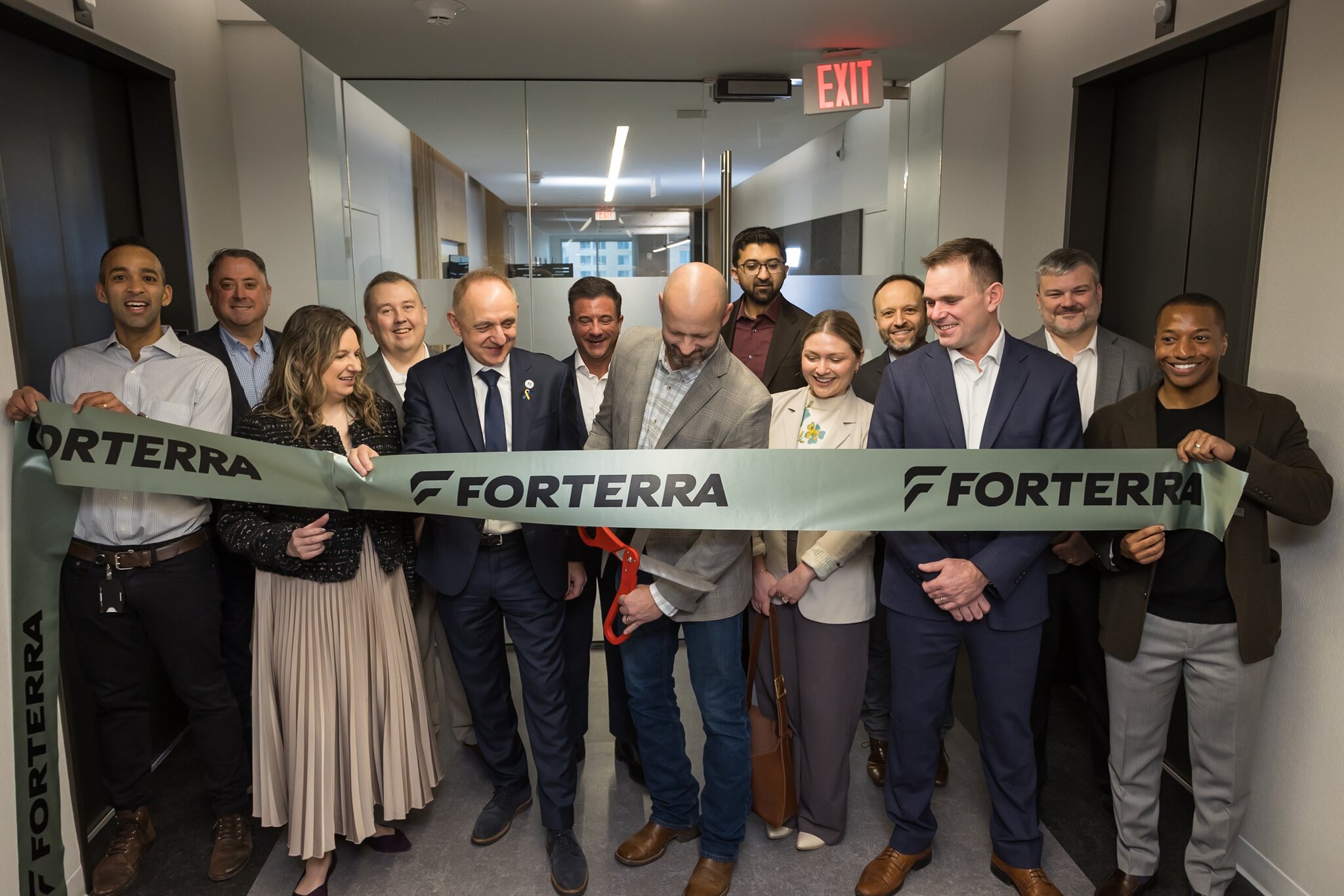 Forterra employees cutting a ribbon