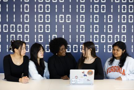 Five University of Virginia Students looking at a laptop