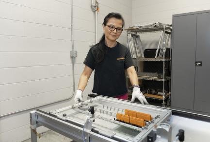 A woman working with electronic components