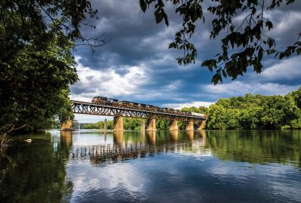 Train on track above water