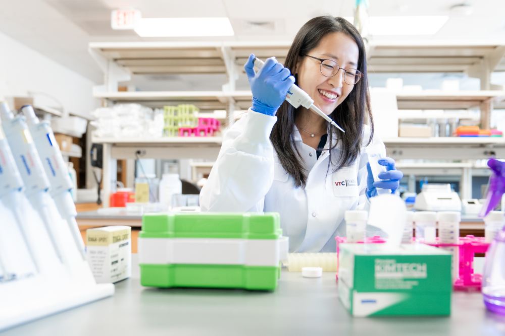 Scientists pipettes solution at the Fralin Biomedical Research Institute in Roanoke, VA