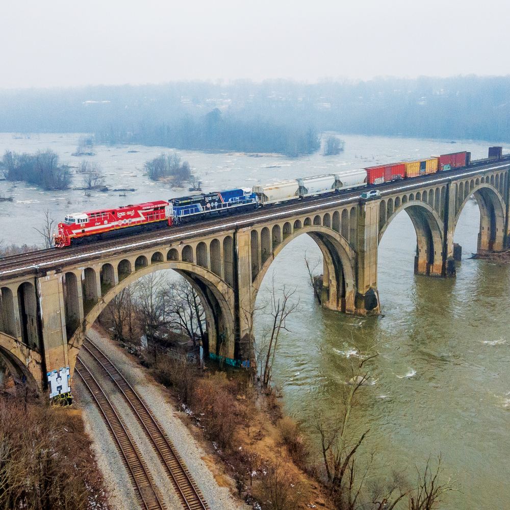Freight train cars ride over the St. James river outside Richmond