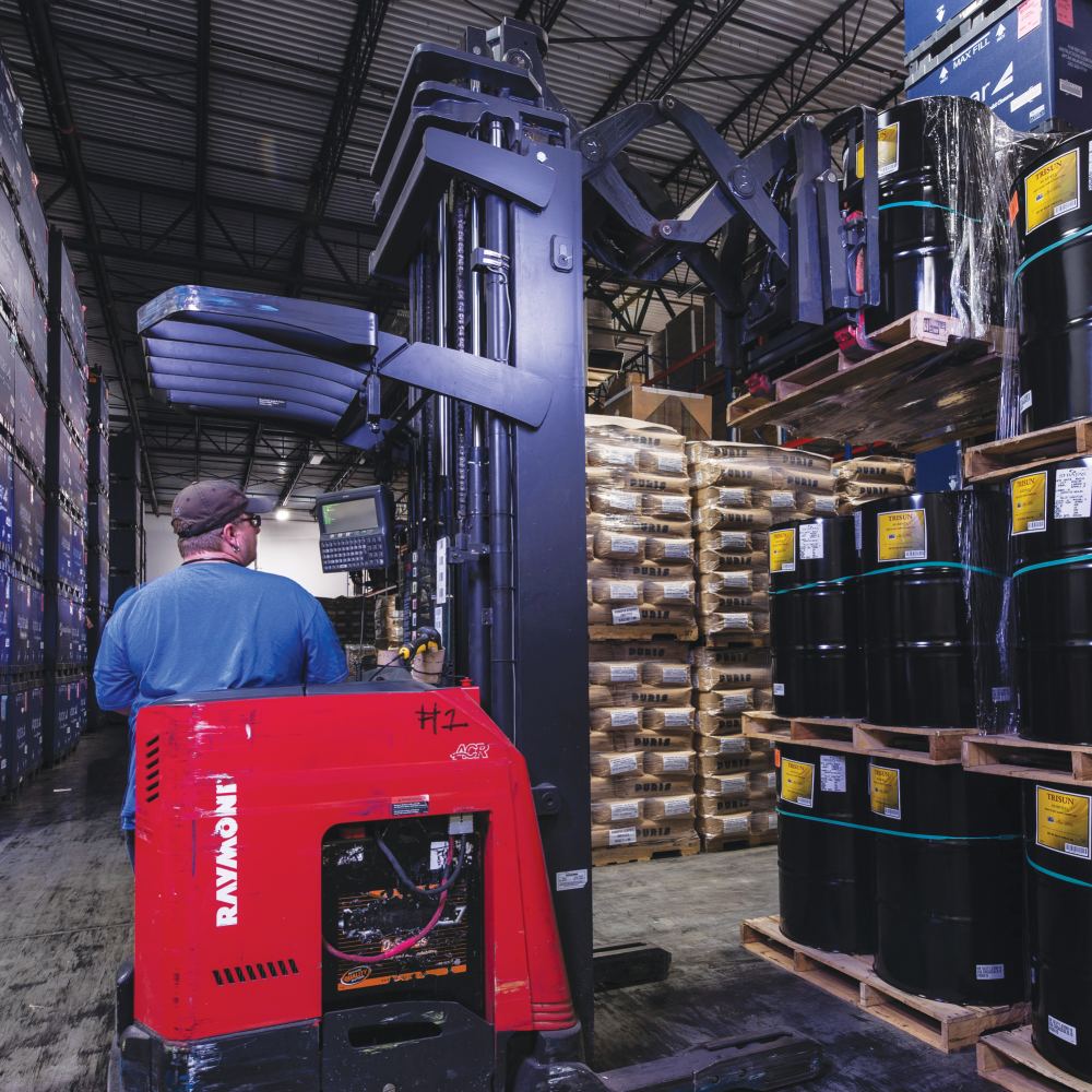 An employee of InterChange Group, Rockingham County drives equipment in the warehouse
