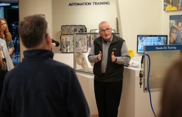Man speaking to a group of people