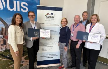 Photo of VEDP employees holding award