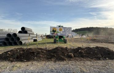 Photo of shovels breaking ground at new site