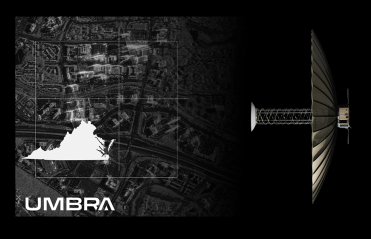 Black and white photo of a satellite in space