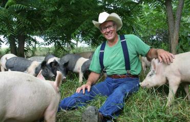 Joel Salatin with pigs