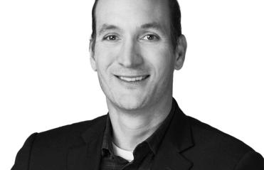 Black and white headshot of Brand Medairy