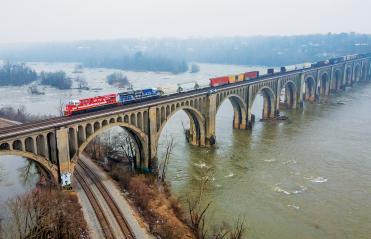 CSX Locomotive train going over a bride on the James River in Richmond