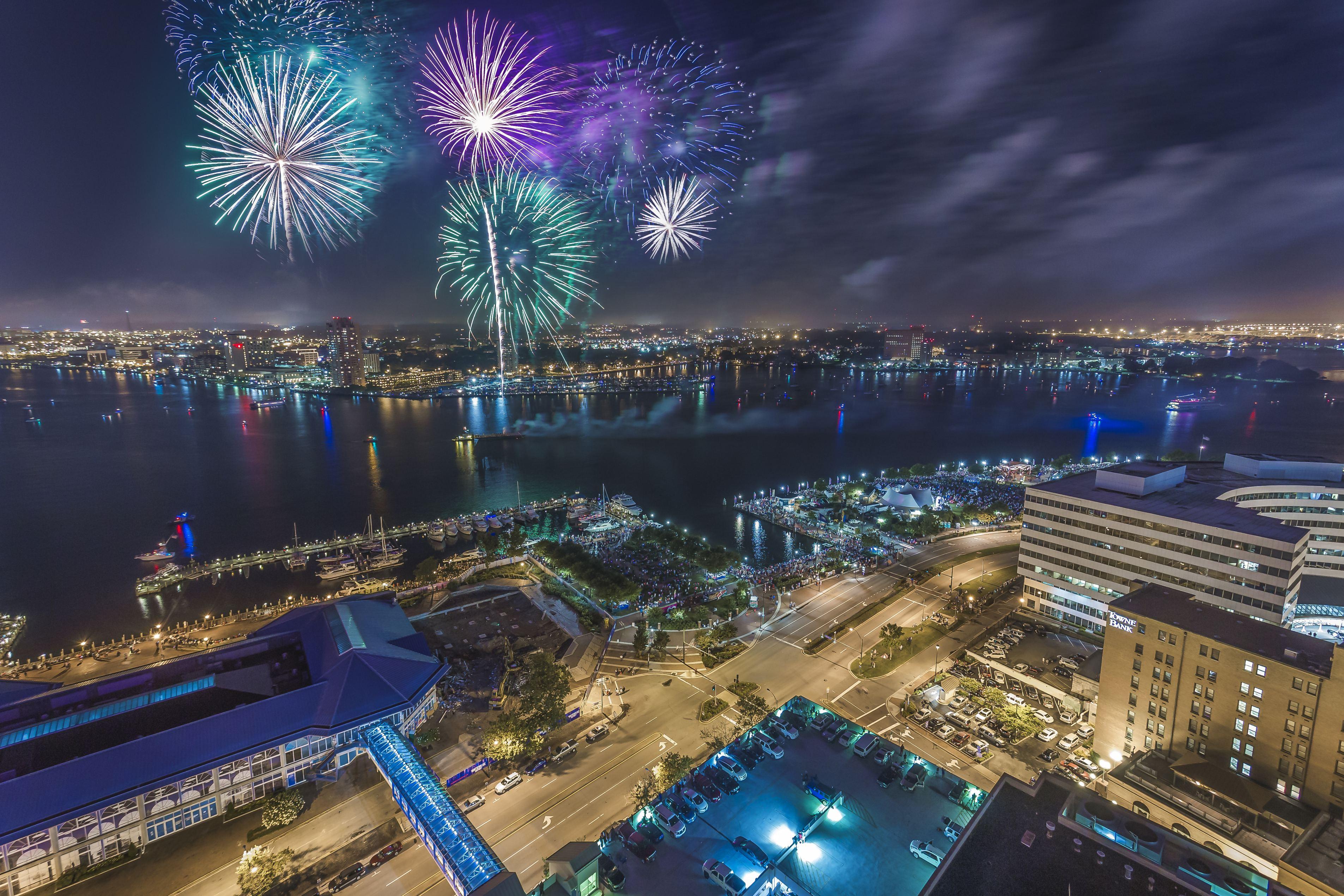 Fireworks over the Norfolk waterfront at night