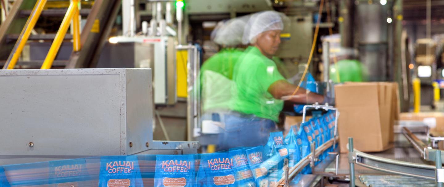 A woman working on a conveyor belt