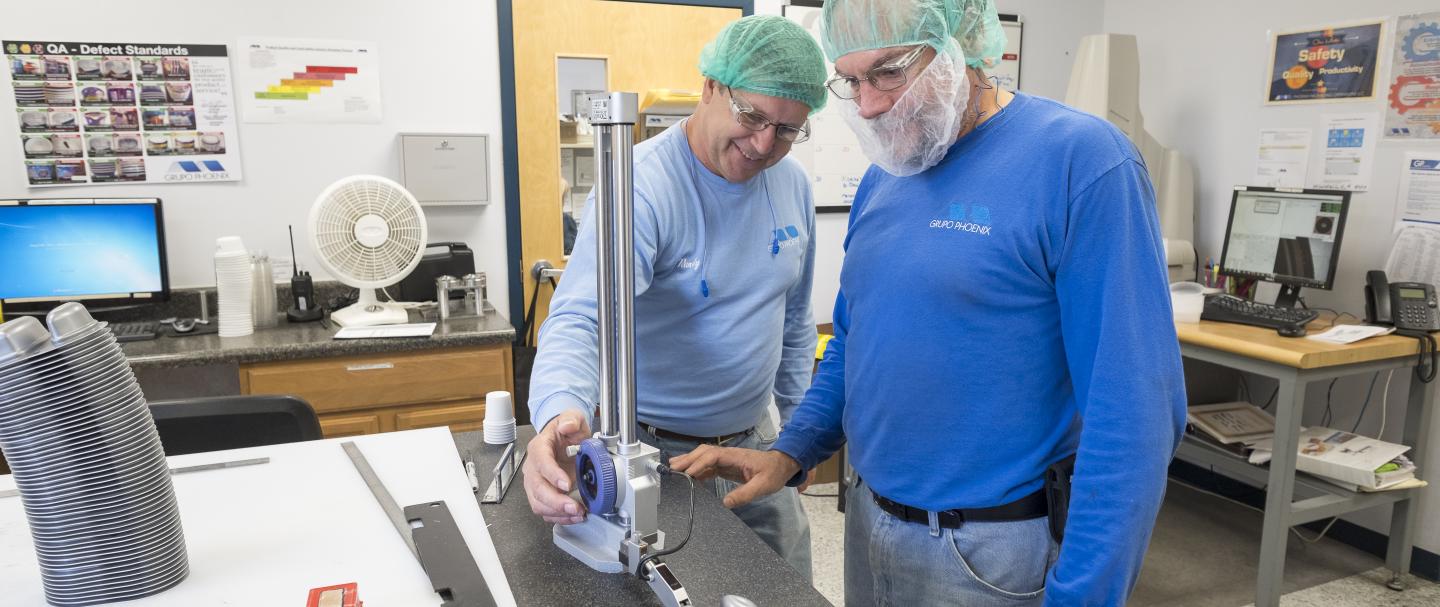 Two men looking at a piece of laboratory equipment