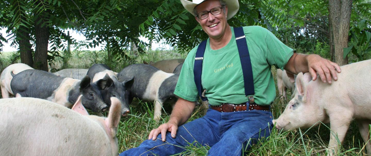 Joel Salatin with pigs