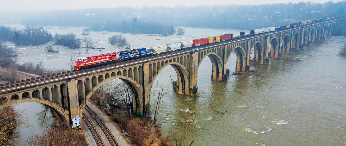 CSX Locomotive train going over a bride on the James River in Richmond