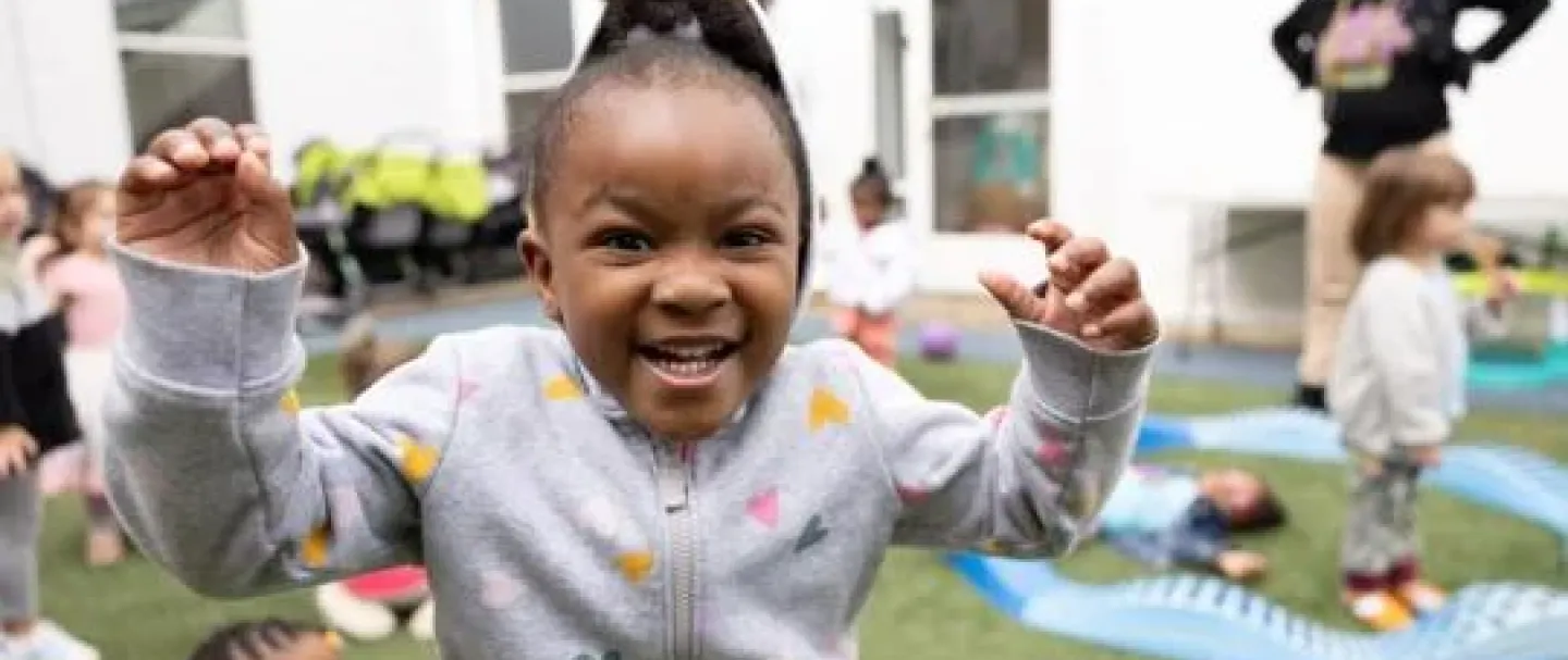 Child playing on playground during daycare