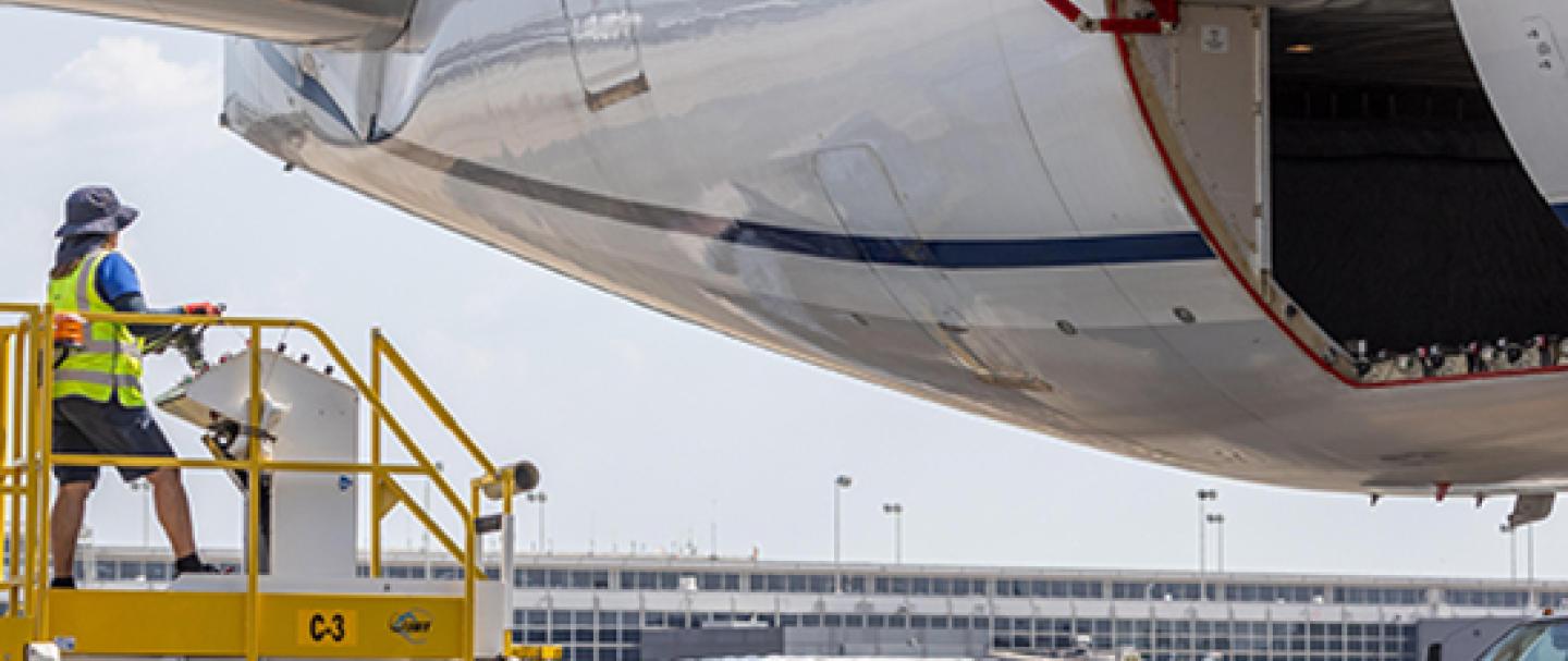 United Airlines plane and employee at Dulles
