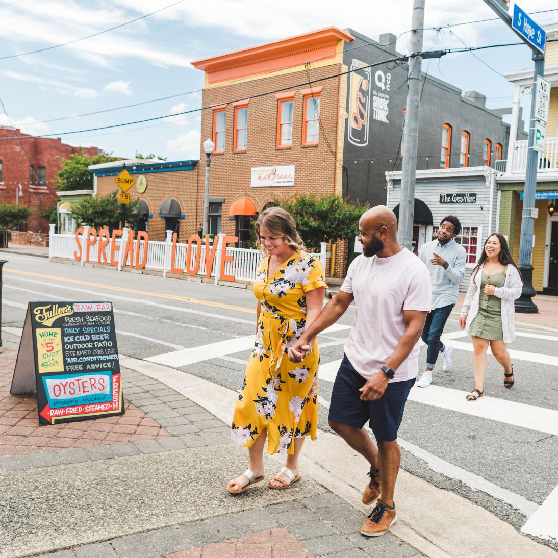 Photo of a couple walking across the street