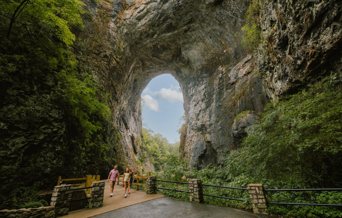 A family walking through Natural Bridge