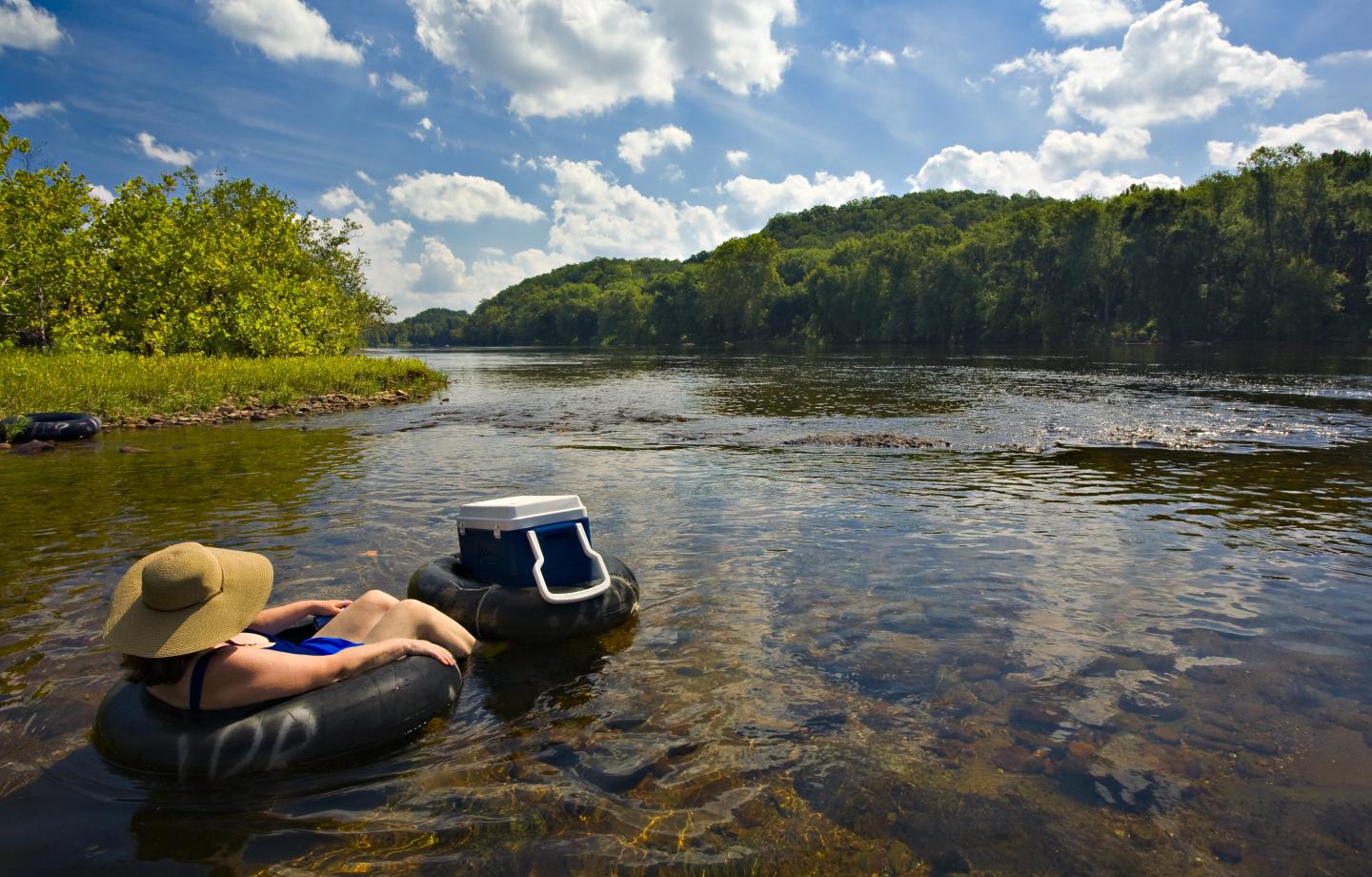 Person floats in an innertube on the James River in Scottsville 