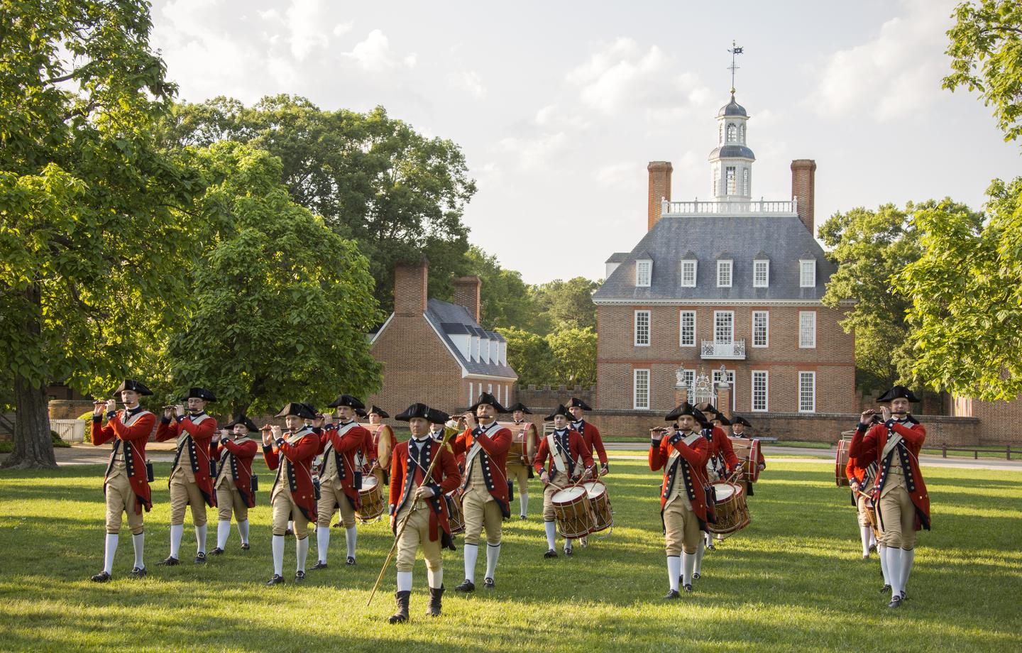 A group of reenactors perform in front of the Governor's Palace in Williamsburg