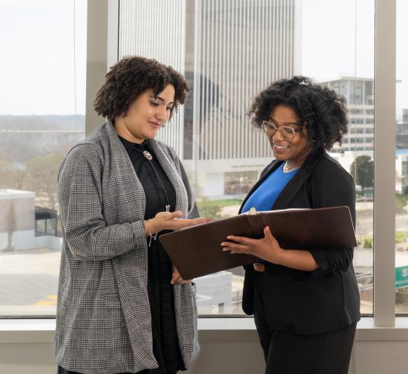 VEDP staff looking at a folder