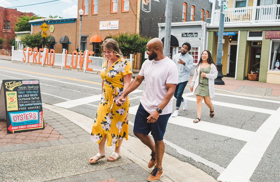 People walking through a shopping and dining district