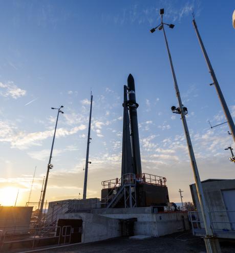 A rocket at a launch complex at sunrise