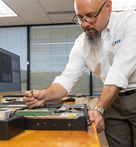 A man working with electronic components