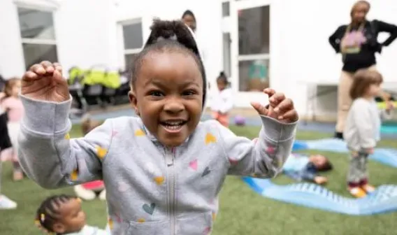Child playing on playground during daycare