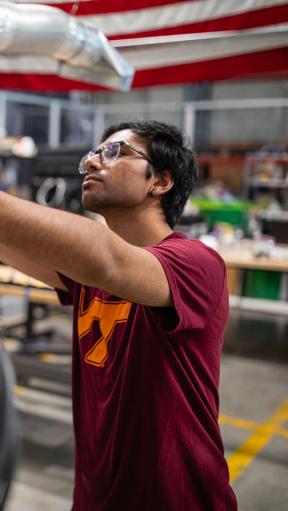 A young man working on a machine