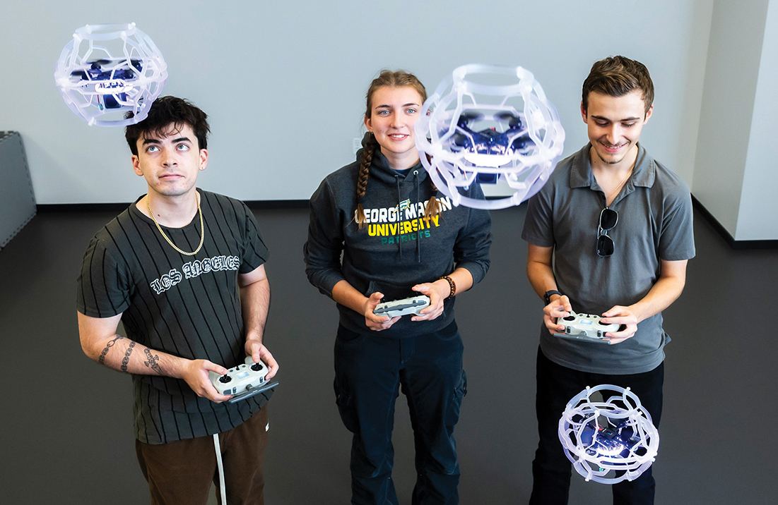 George Mason students working with technology