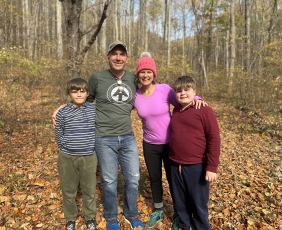VEDP CEO and President, Jason El Koubi stands with his family while on a hike in Virginia's Shenandoah Valley
